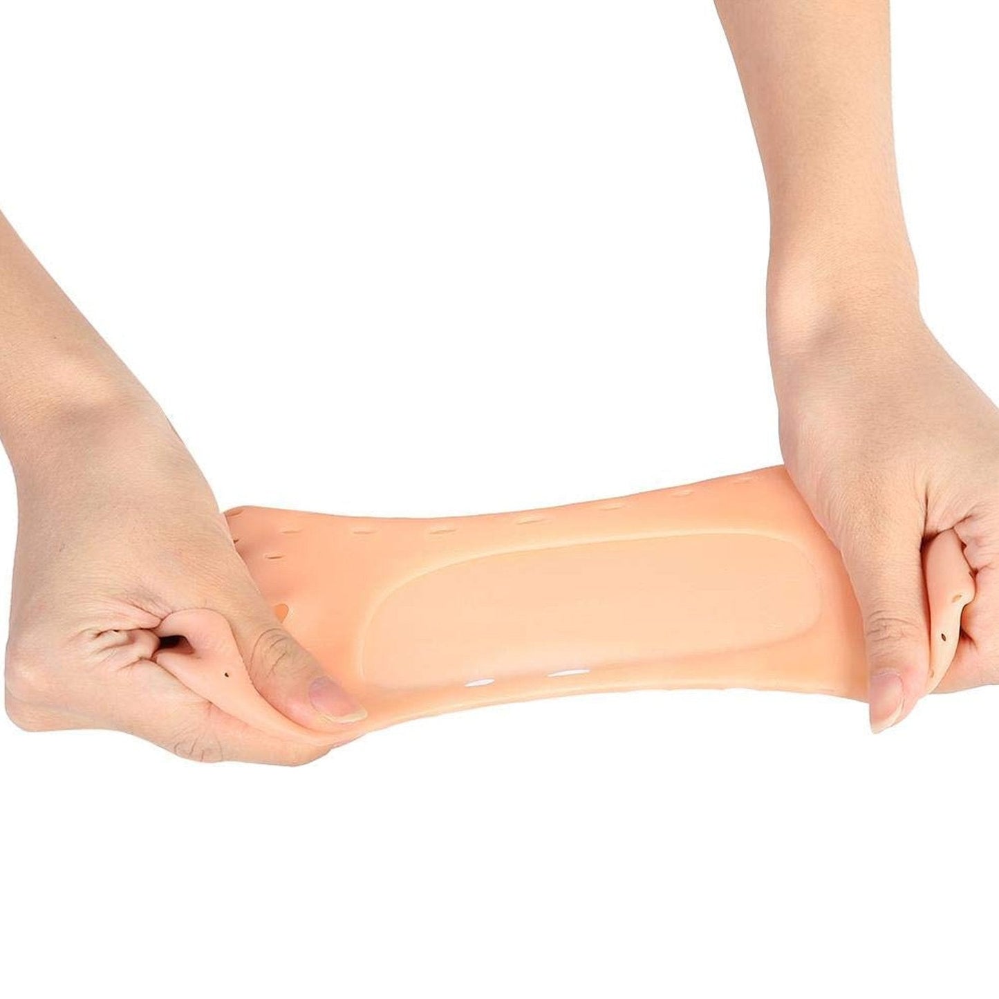 Two hands stretching a single peach silicone heel sock, demonstrating its elasticity.