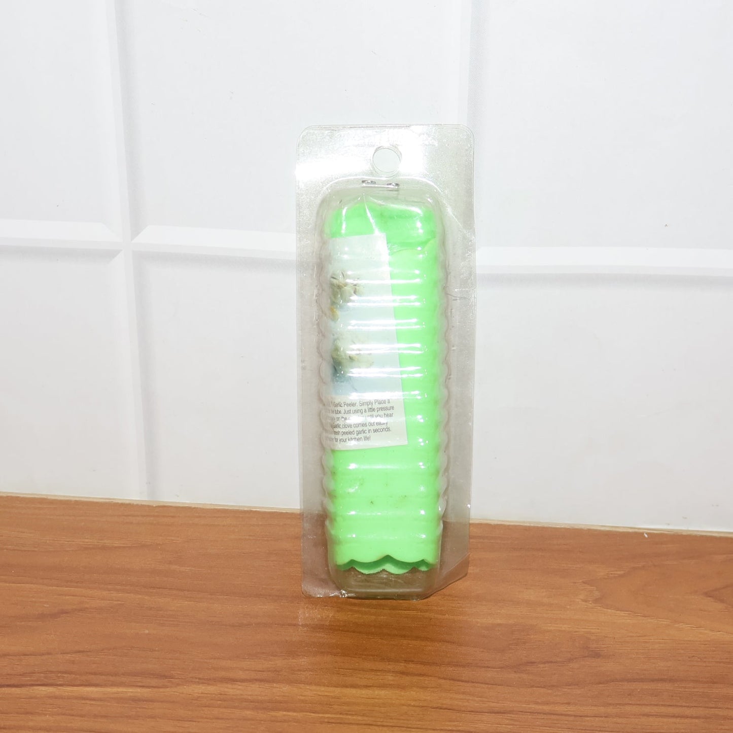 Compact silicone garlic peeler tube stored in kitchen drawer