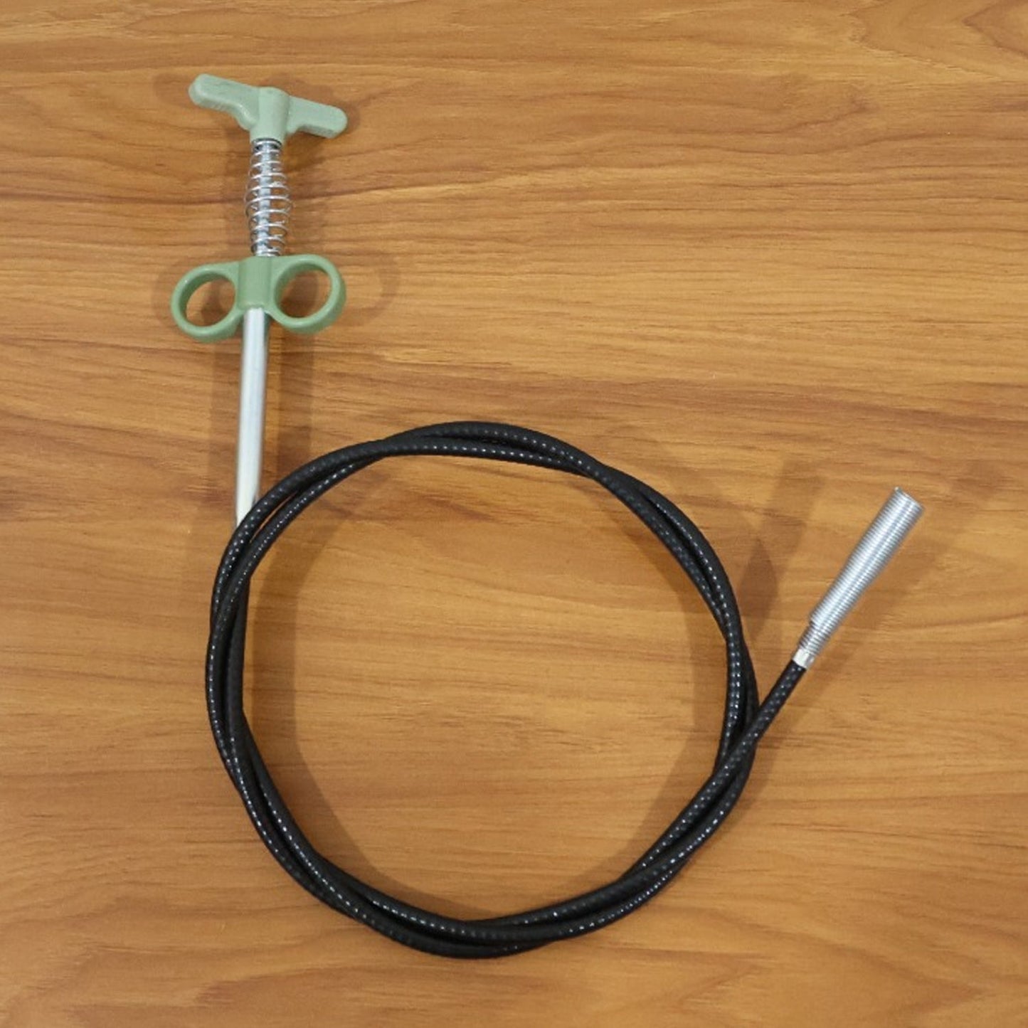 Flexible spring drain cleaning tool with ergonomic hand grip and claw