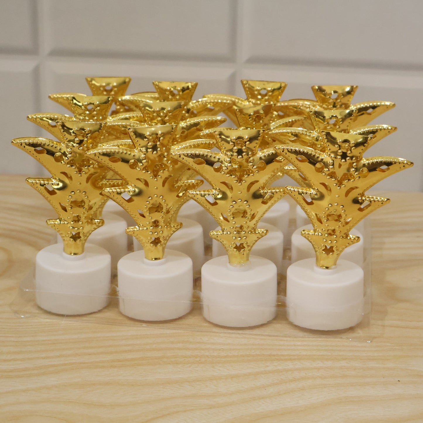 Live photo of golden Christmas tree LED tealight candles