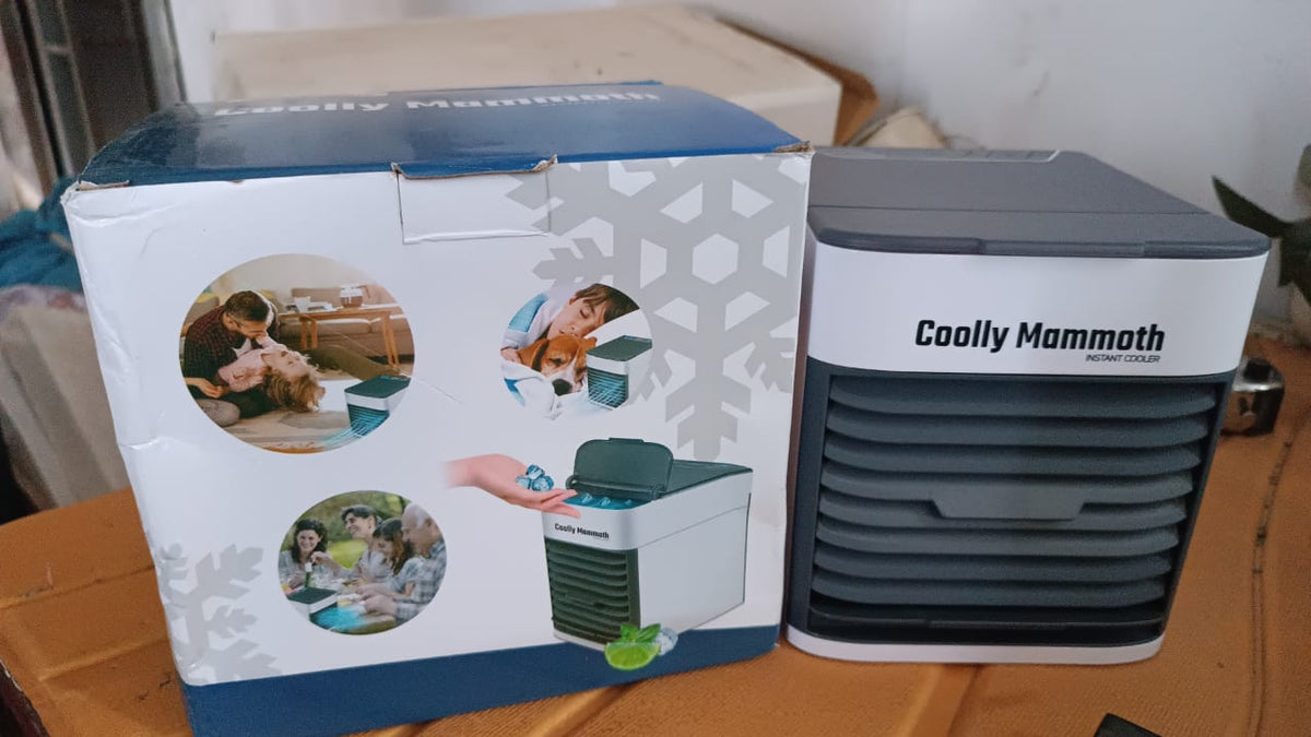 Lifestyle shot of the portable personal air cooler with LED in a modern setting.
