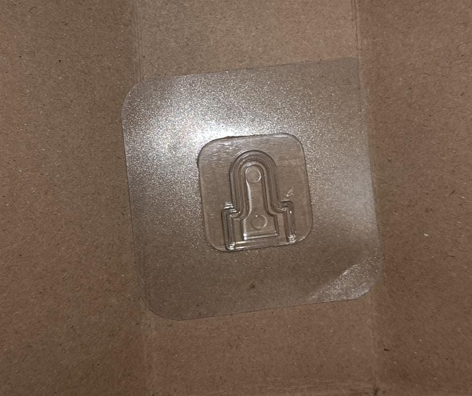 Transparent adhesive hooks neatly packaged for safe delivery and convenient storage.