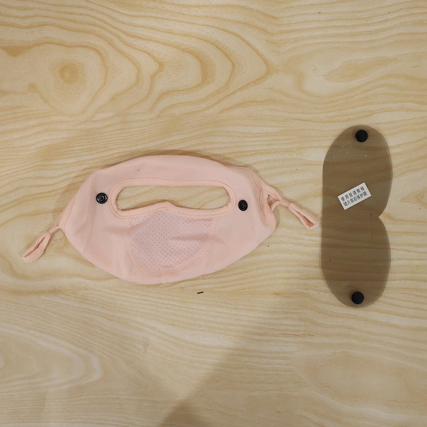 Live photo of reusable cloth face mask with eye shield