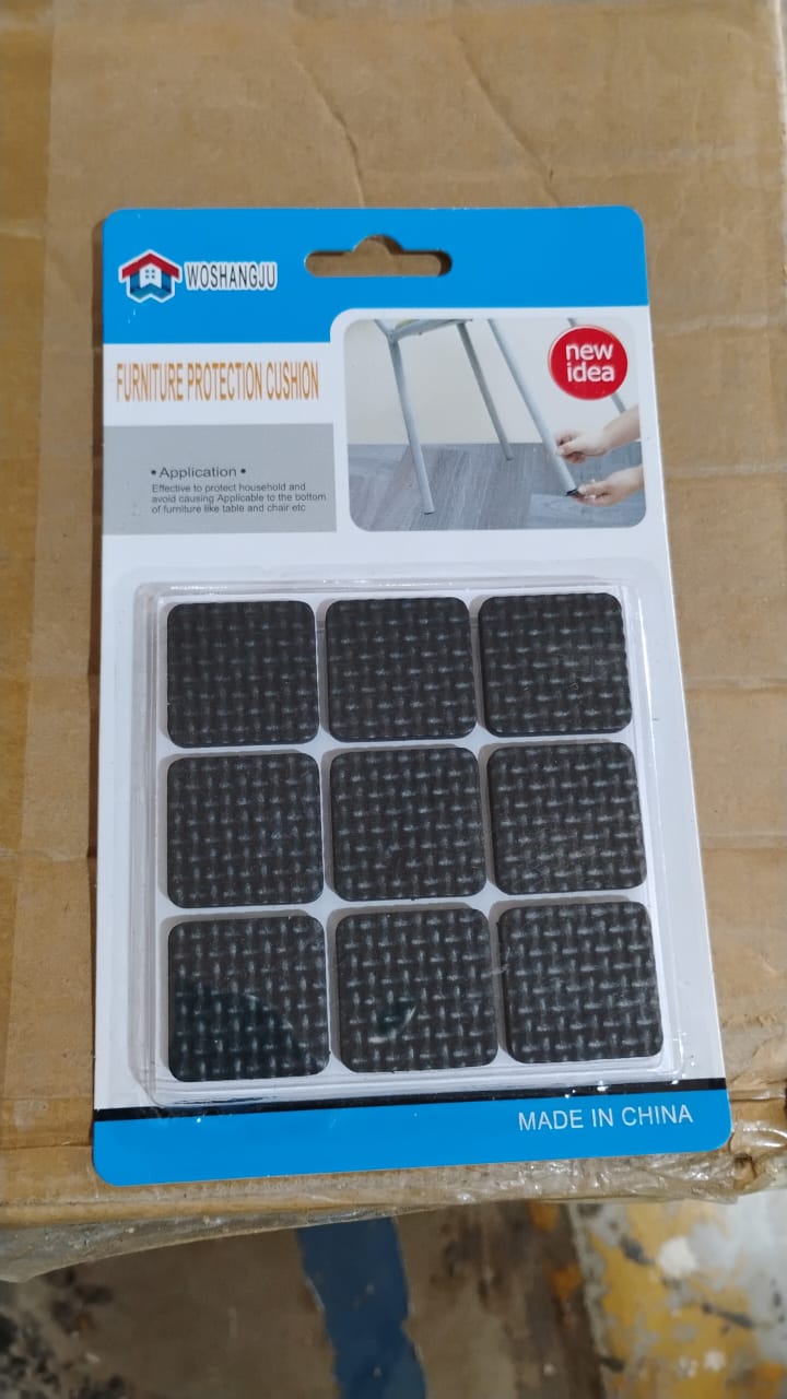 A retail package of nine black square self-adhesive furniture protection cushions.