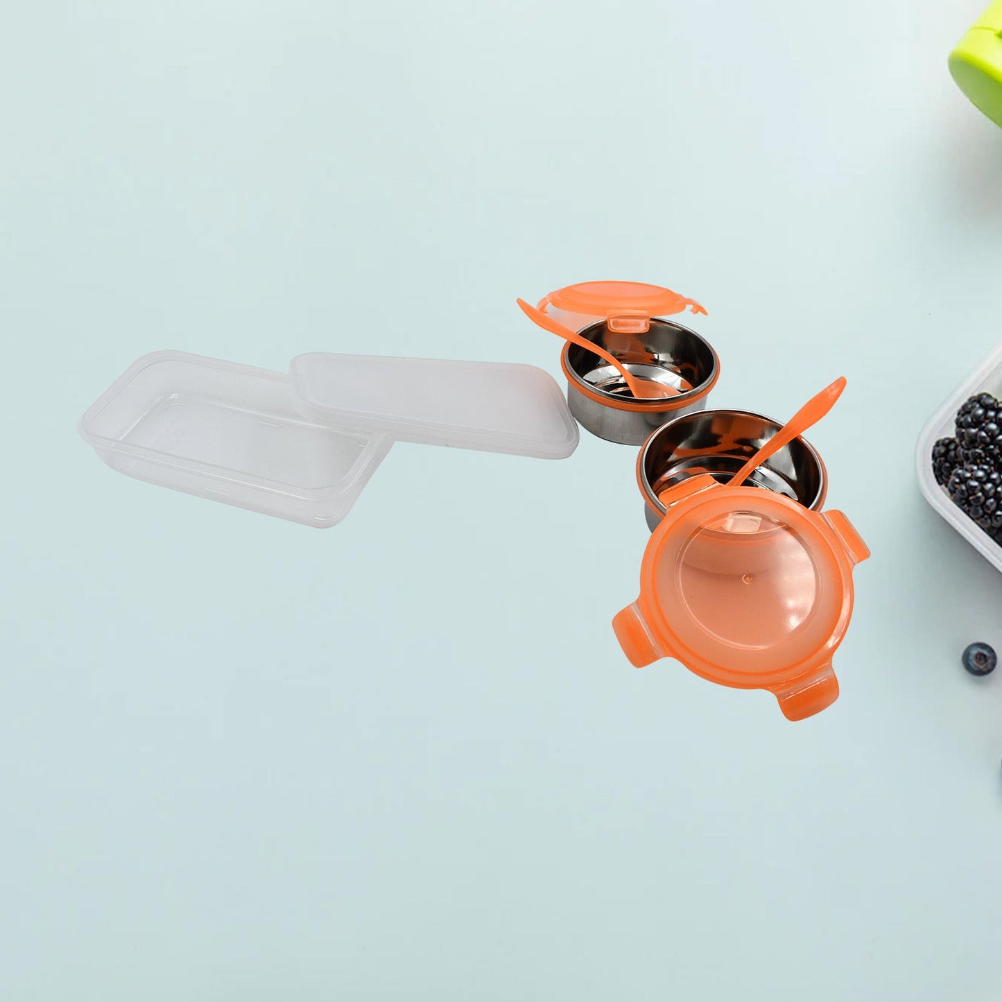 A stainless steel lunch box filled with a delicious, fresh Indian meal.