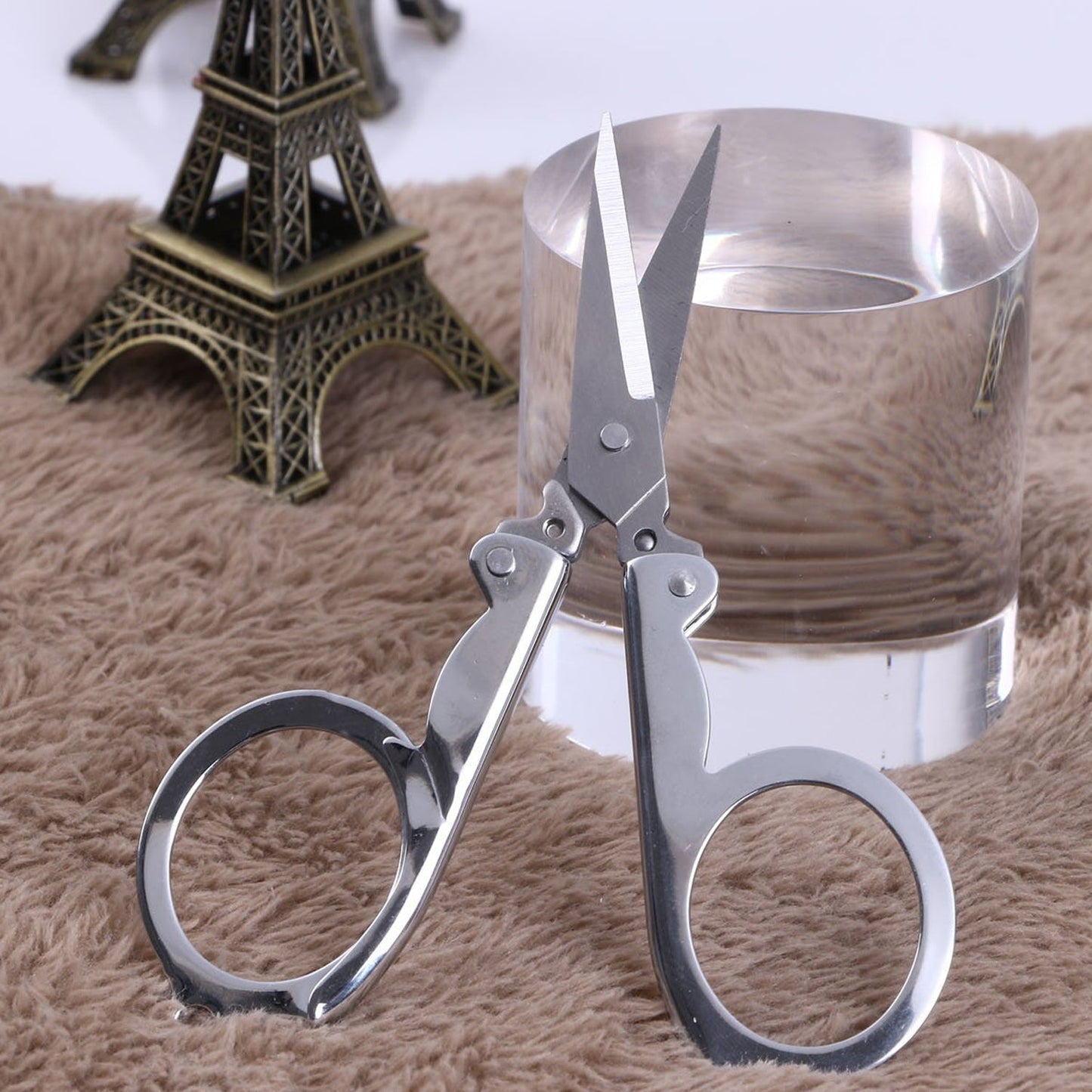 The complete silver stainless steel folding pocket scissors, ready for all your cutting needs.