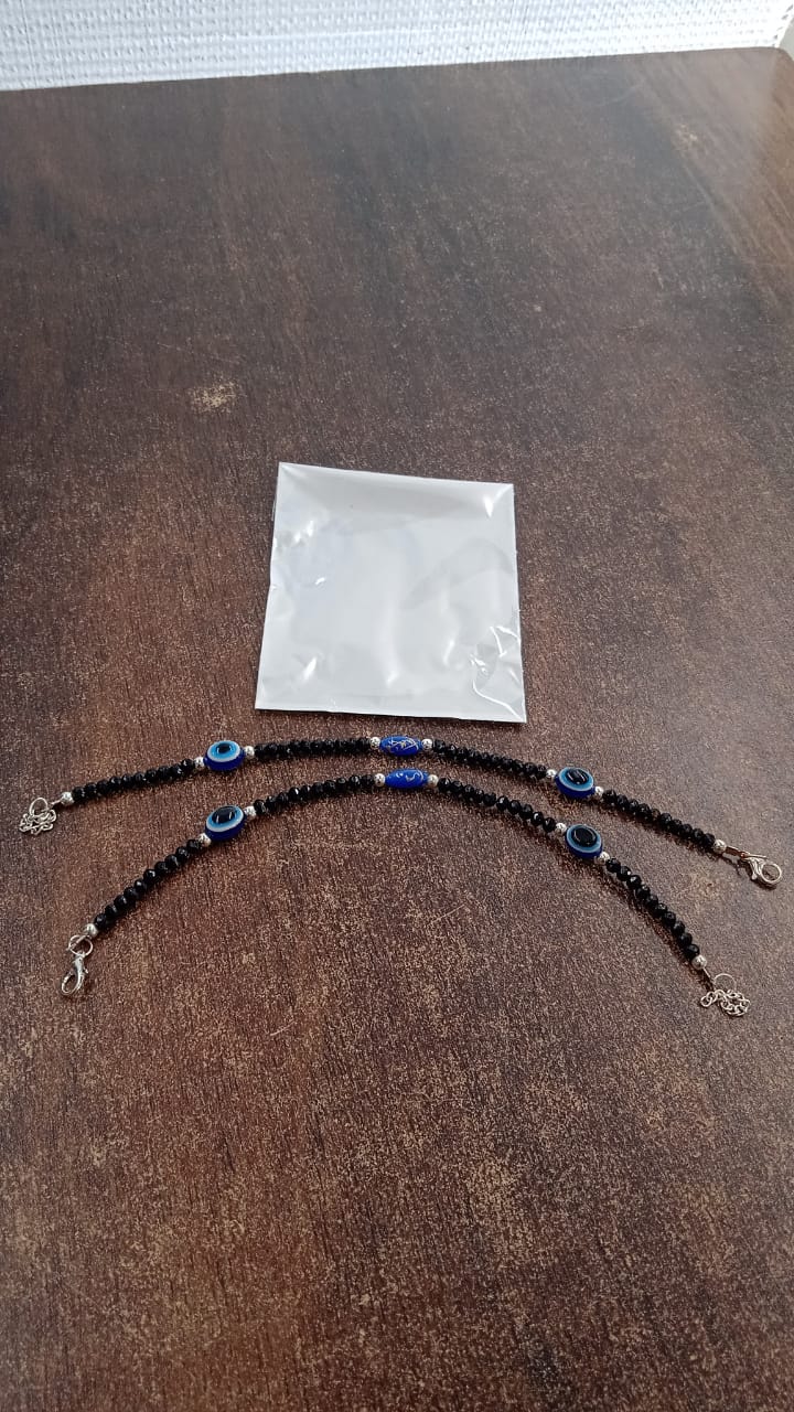 Evil eye bracelet set displayed on a wrist demonstrating adjustability