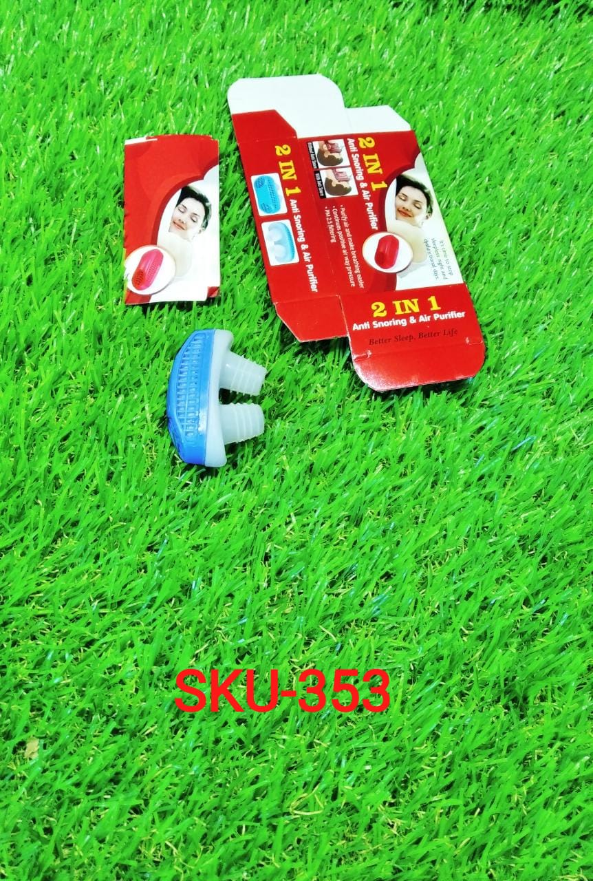 A blue and white anti-snoring nose clip next to its red and white packaging on green artificial grass.