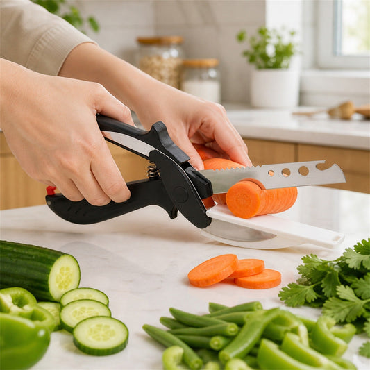 A person's hands use a black and white clever cutter to slice a carrot on a white countertop with vegetables around it.