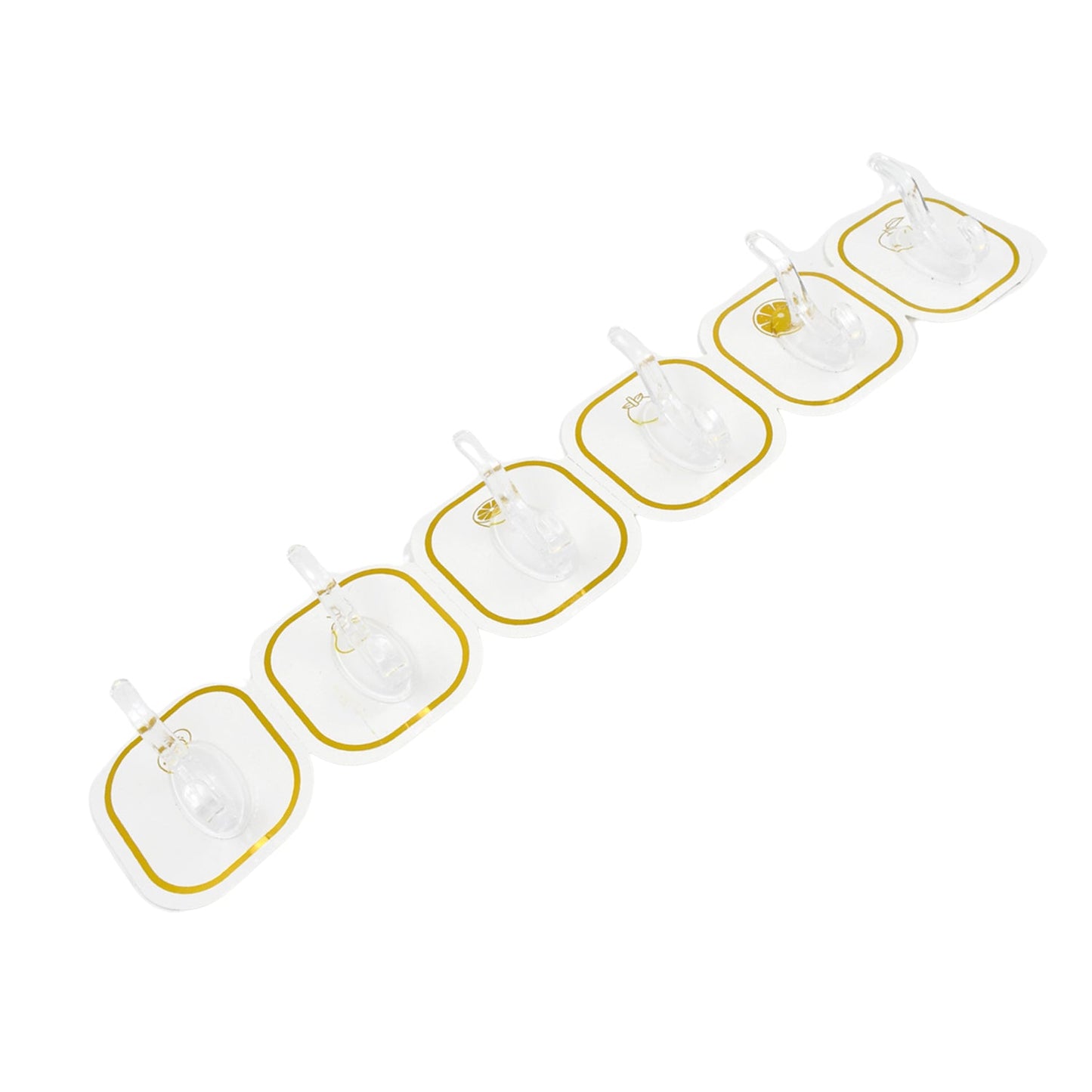 Six transparent adhesive hooks with gold borders arranged diagonally on a white background.