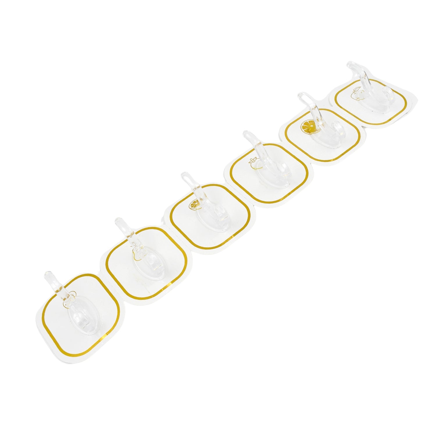 Six transparent adhesive hooks with gold borders arranged diagonally on a white background.
