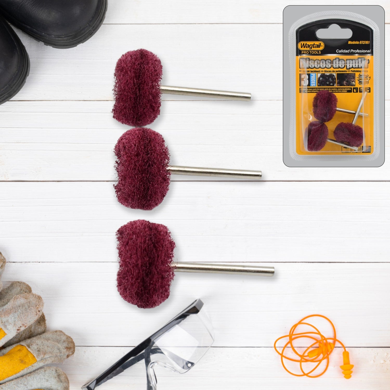 Three maroon buffing wheels with safety gear and a packaged set on a white wooden background.
