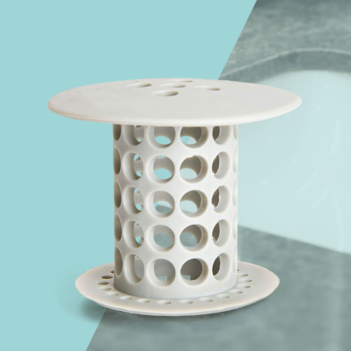 A white silicone tub drain hair catcher stands against a split blue and gray background.