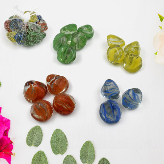 A scattered pile of multi-color decorative garden stones showcasing various hues.