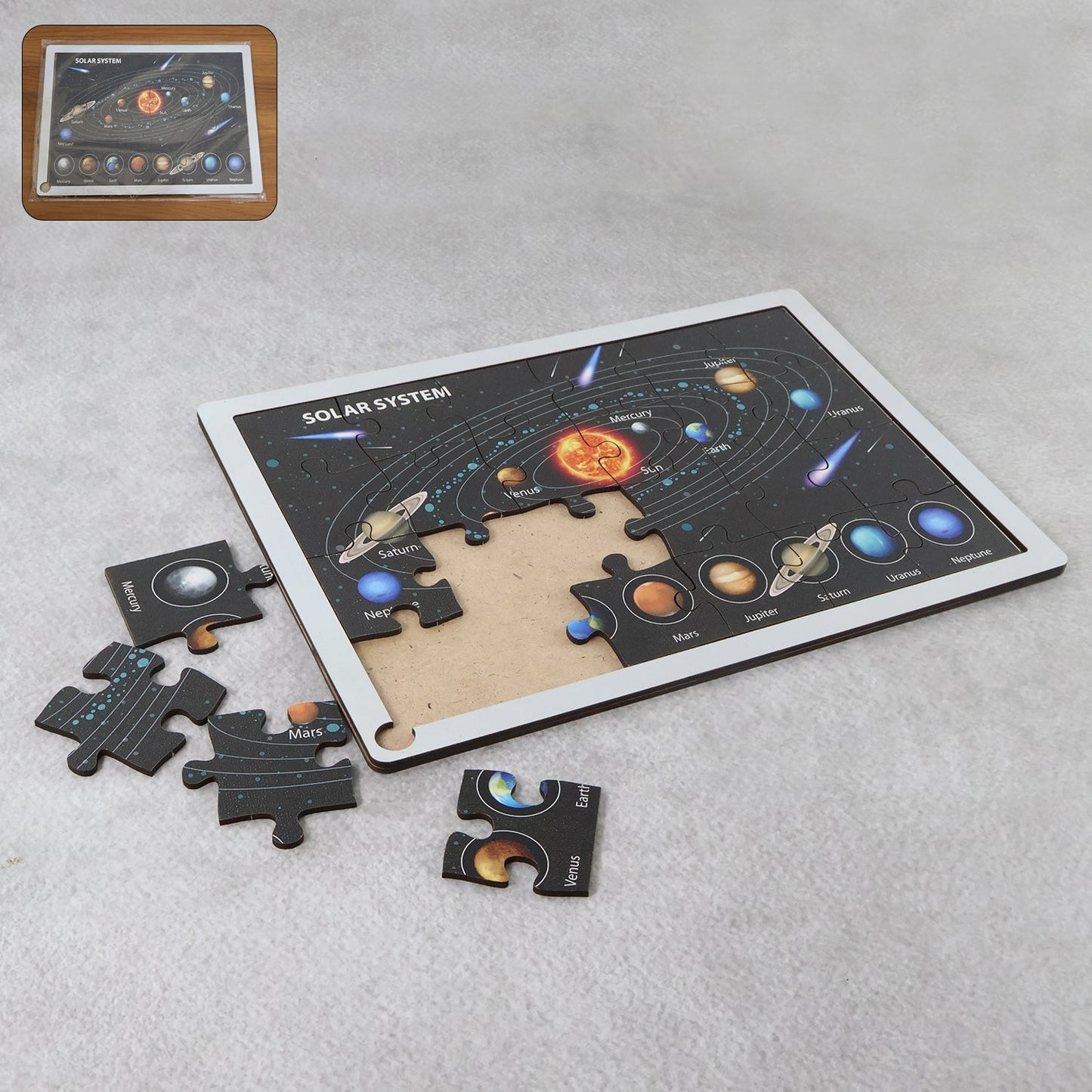 Top view of wooden puzzle board layout with colorful peg pieces