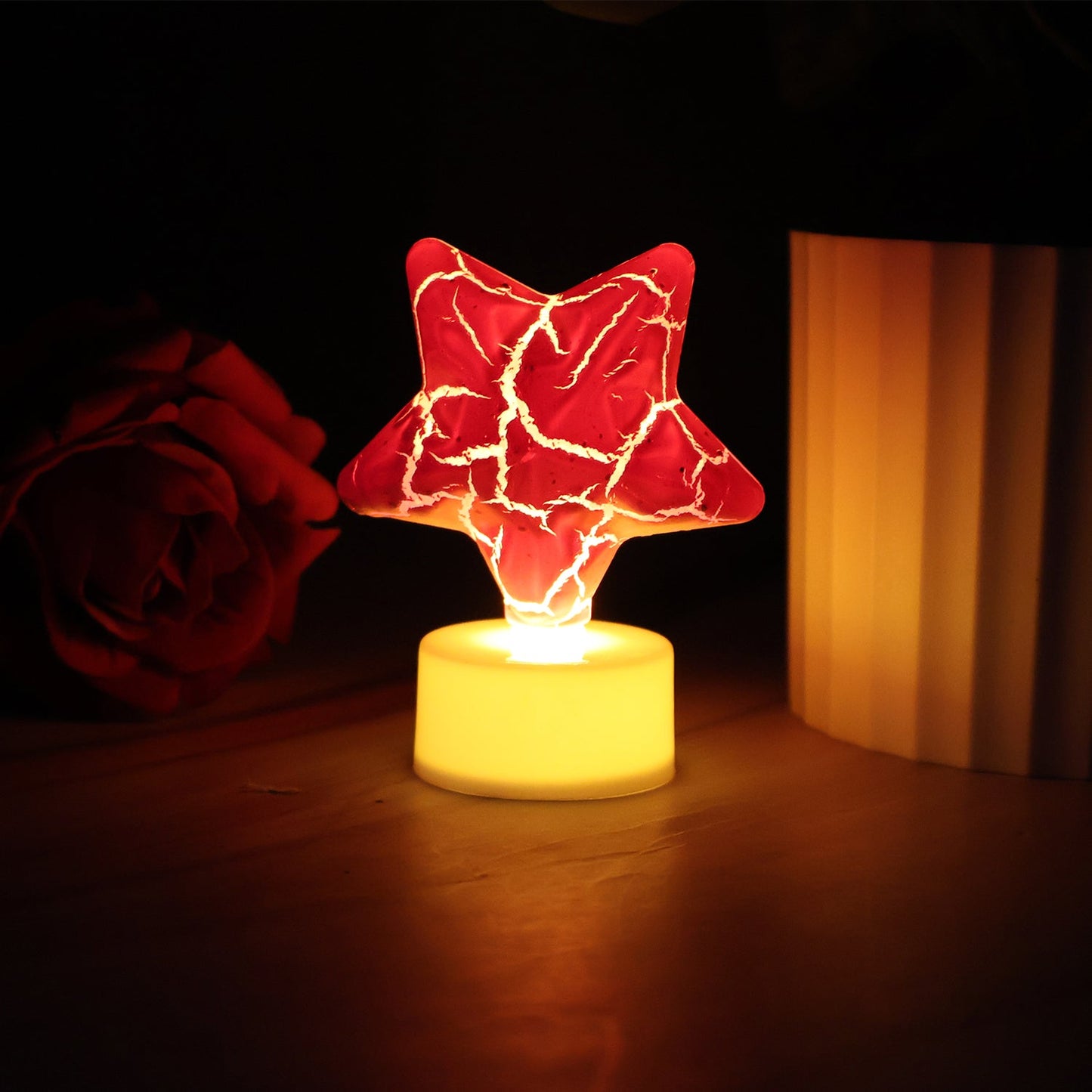 Single star shape decorative LED tealight candle showing battery base