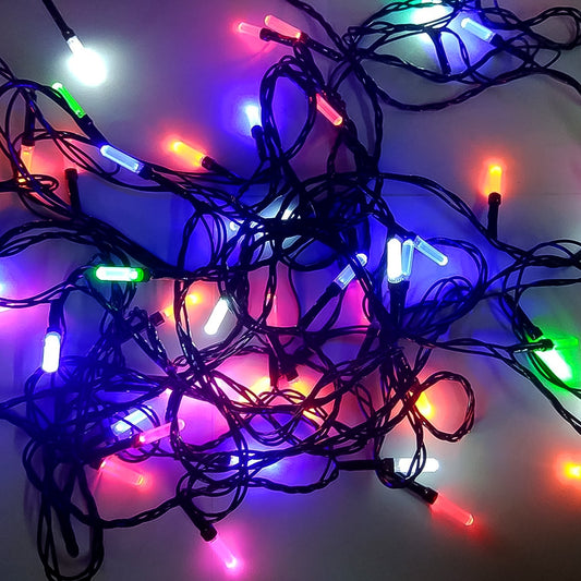 Multi-color Diwali LED string light illuminating a festive home setting.