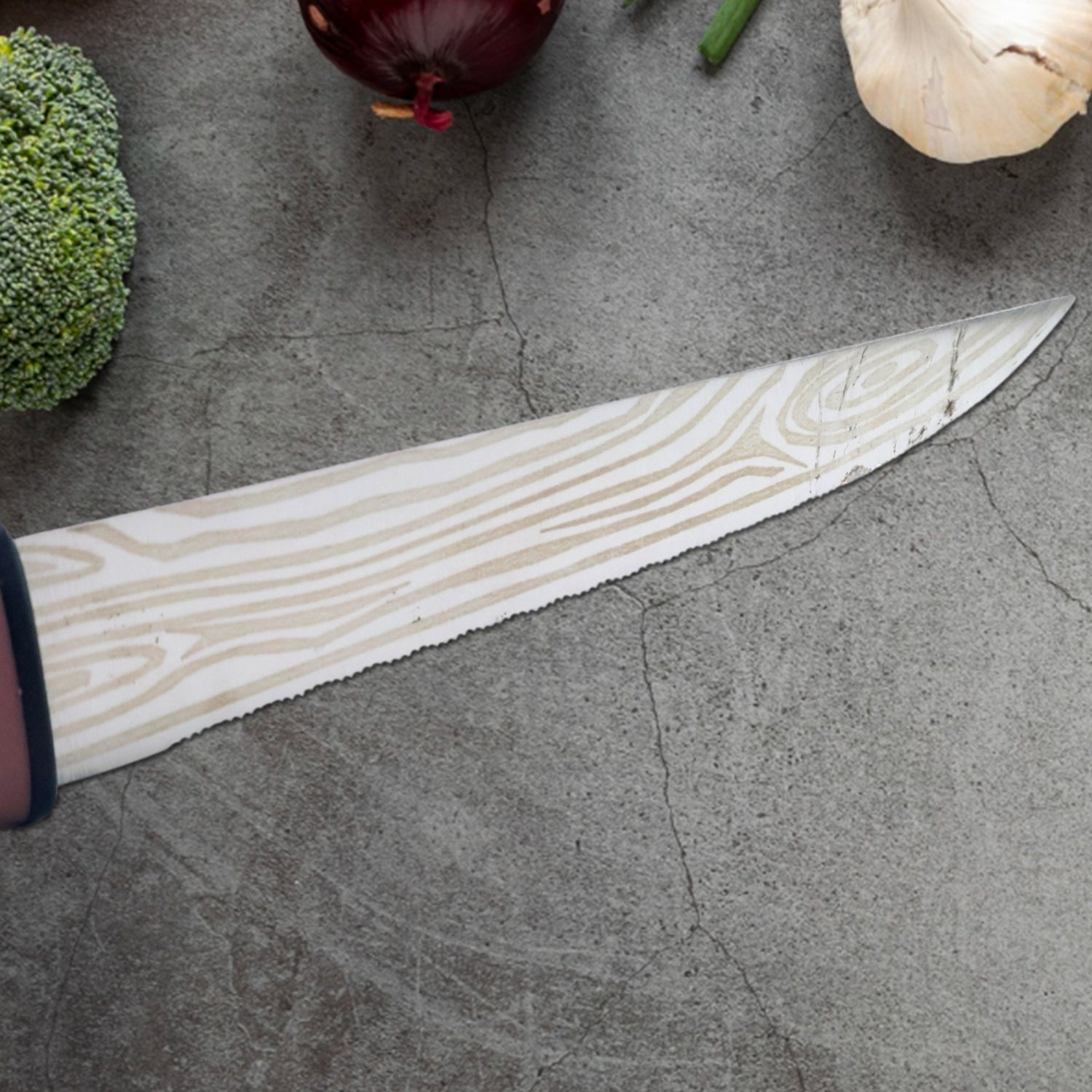 Angled view of kitchen cutting knife highlighting blade and handle design