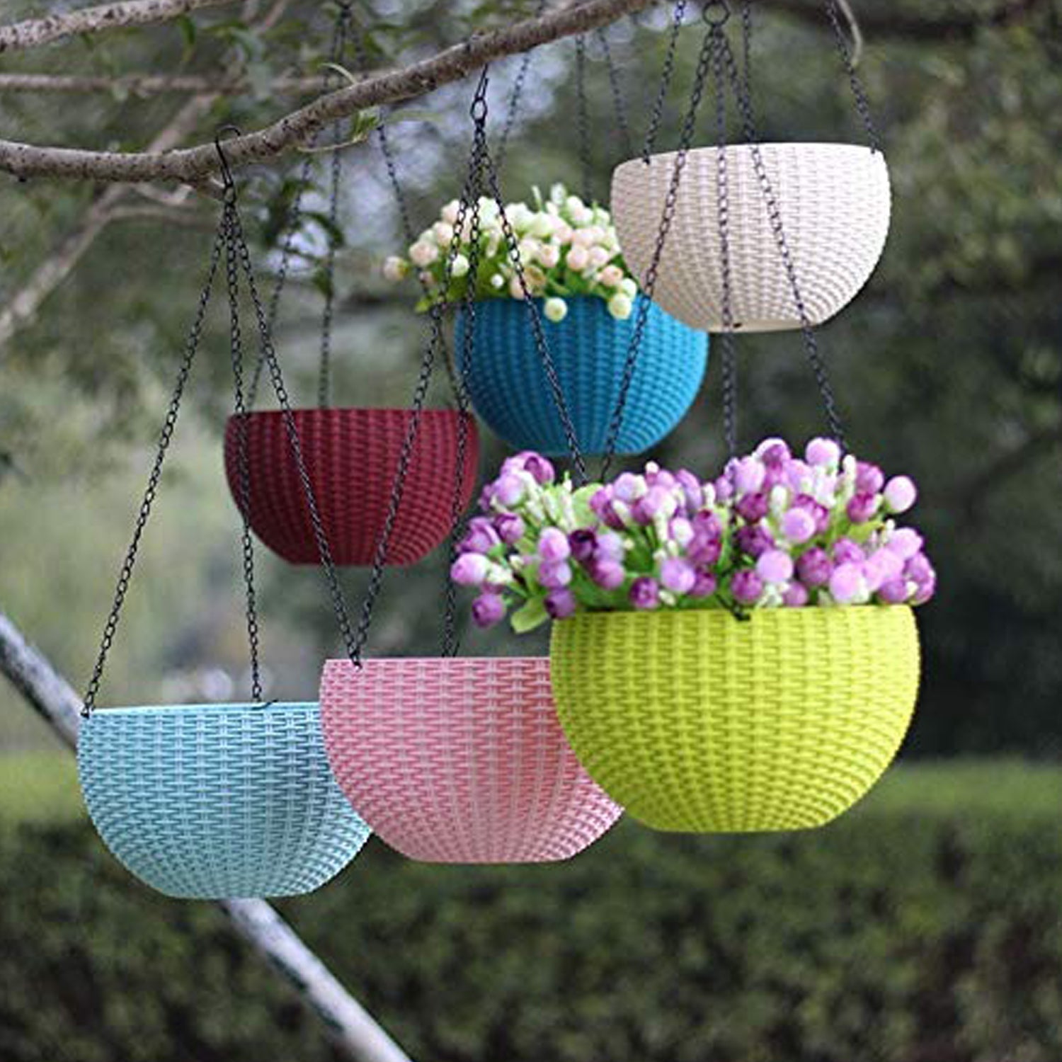 Set of six round plastic hanging flower pots with steel chains on a white background.