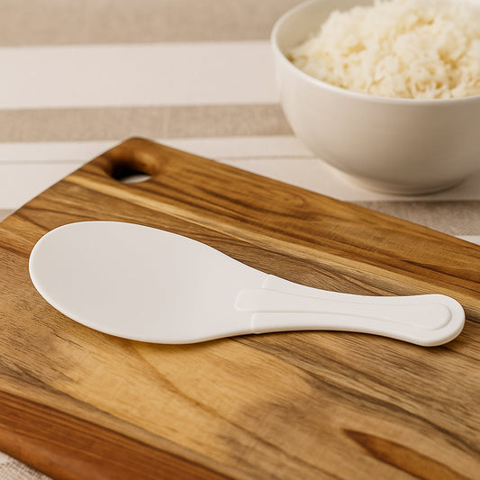 White non-stick rice serving paddle with smooth ergonomic handle