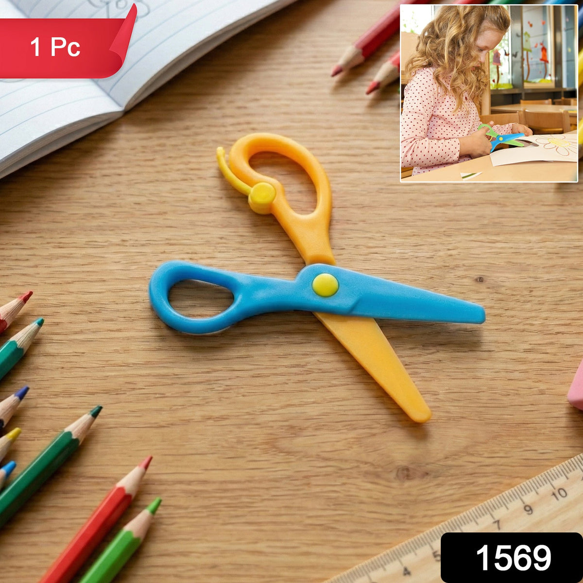 A pair of blue and orange plastic scissors lies on a wooden desk surrounded by colored pencils.