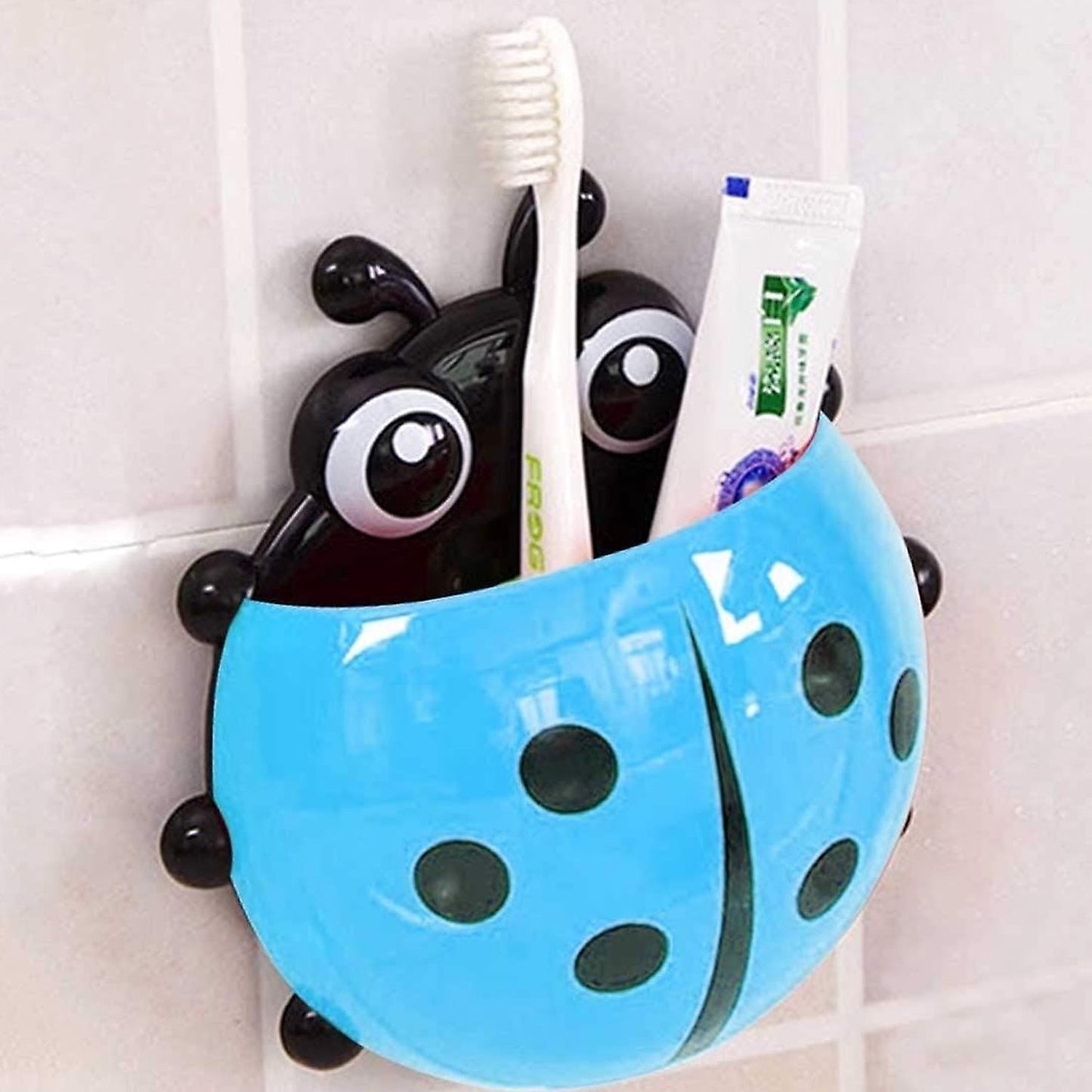 Ladybug Toothbrush Holder holding several toothbrushes, demonstrating its family-friendly capacity.