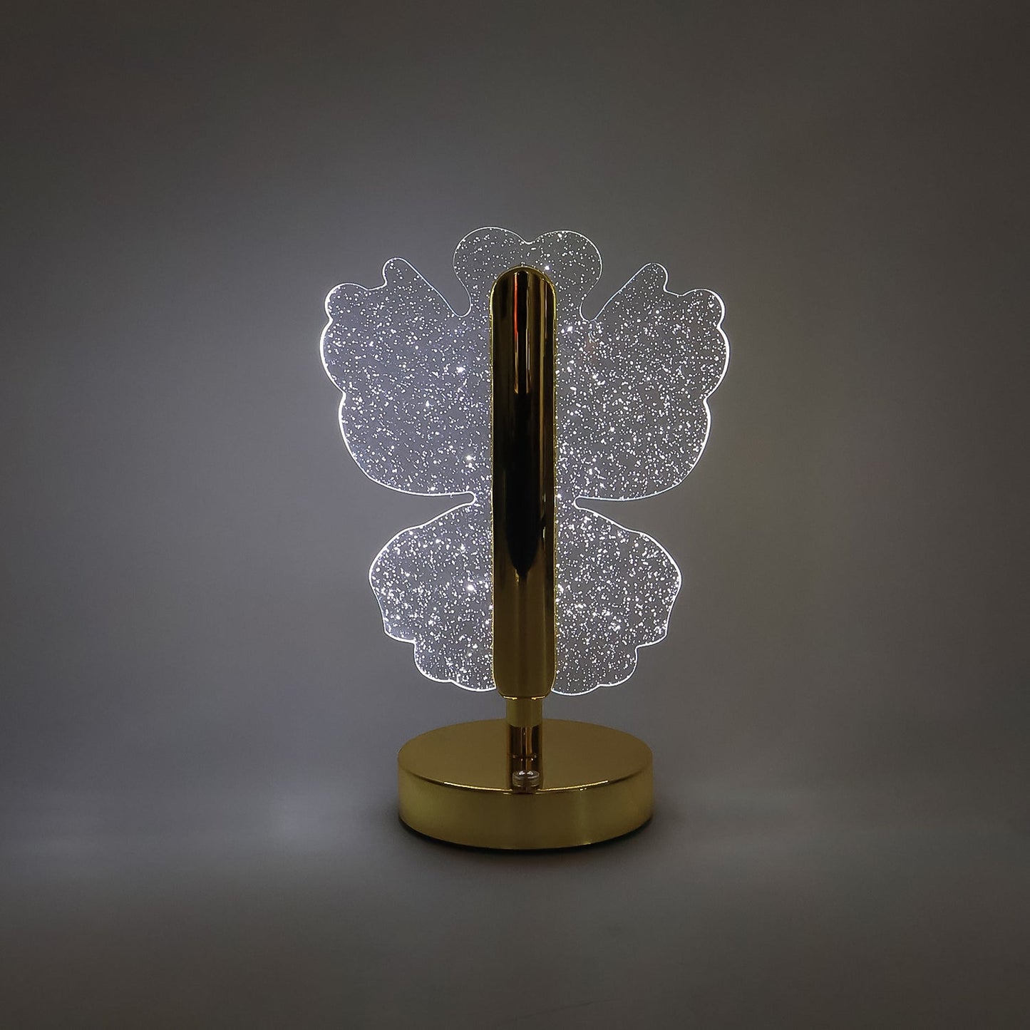 Decorative crystal table lamp emitting warm LED light