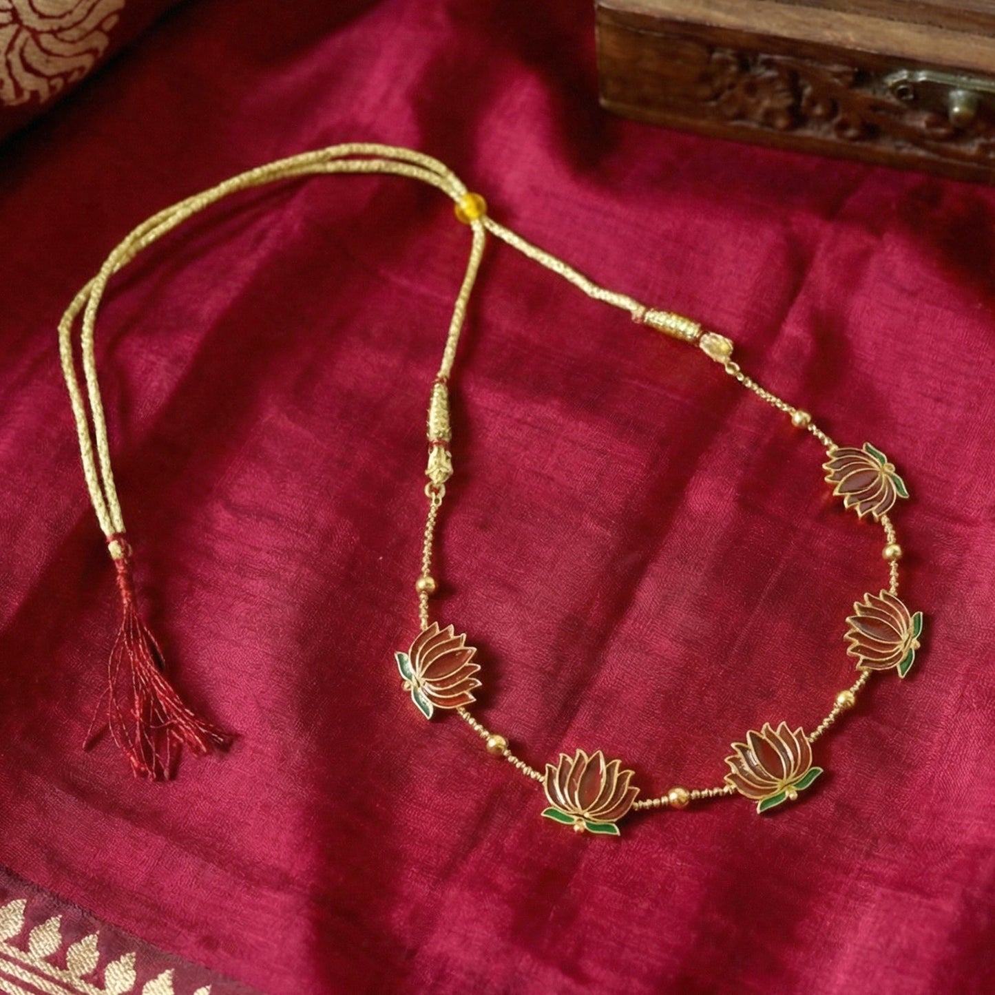 Close-up image of lotus motif necklace detail in traditional jewellery set