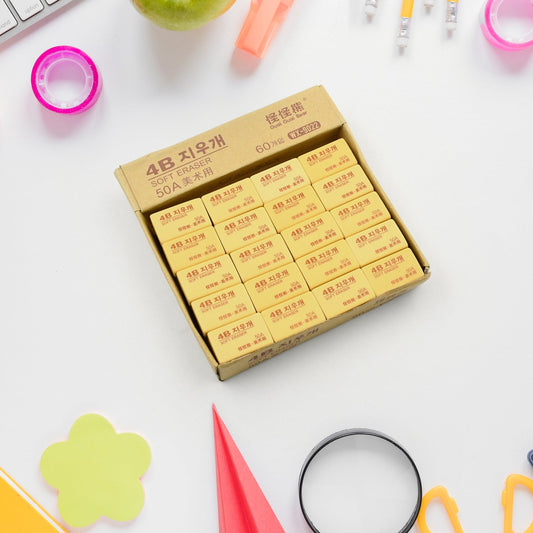 A stack of professional 4B drawing erasers in a 60-piece pack, perfect for artists.