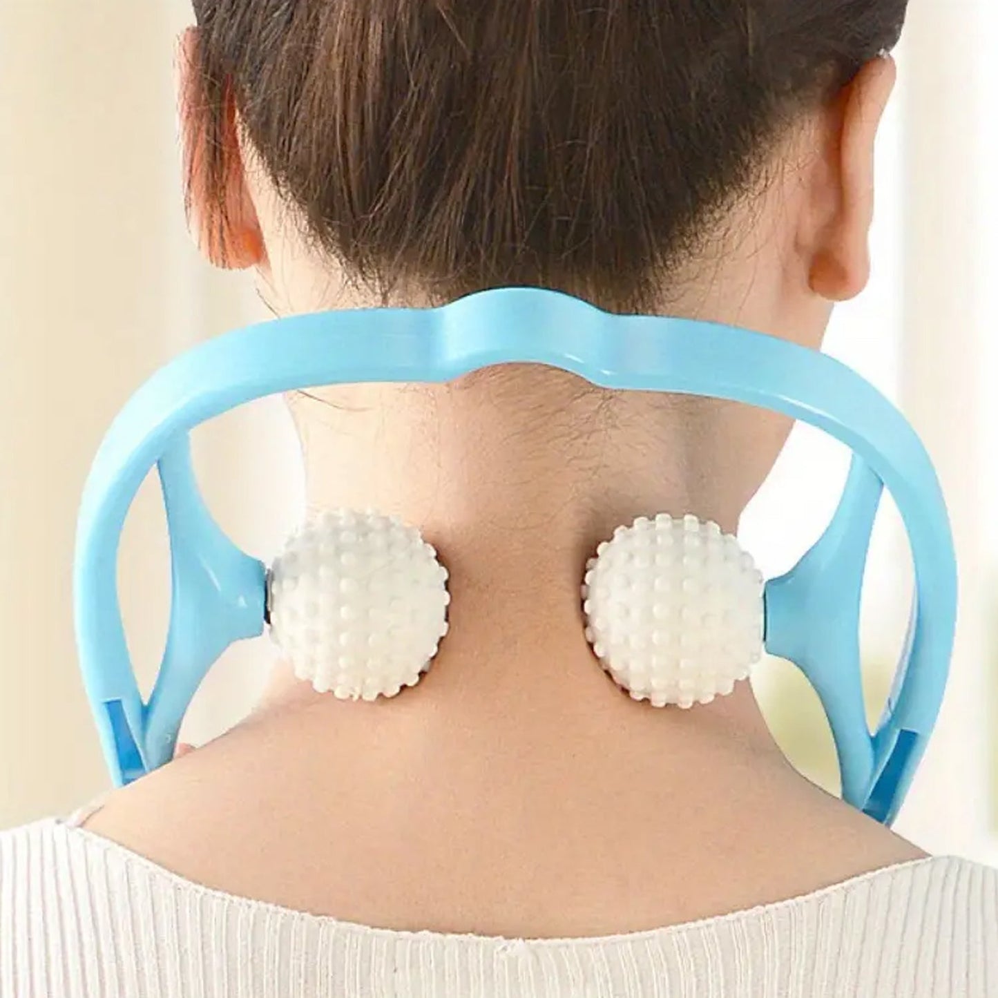 Lifestyle image of a user enjoying the soothing Blue U-shaped neck and shoulder massager.