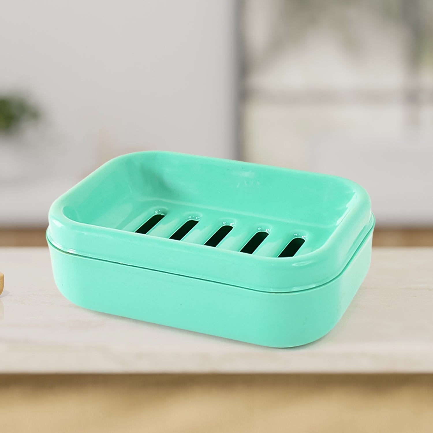 Rectangular aqua green soap case showcasing robust plastic material