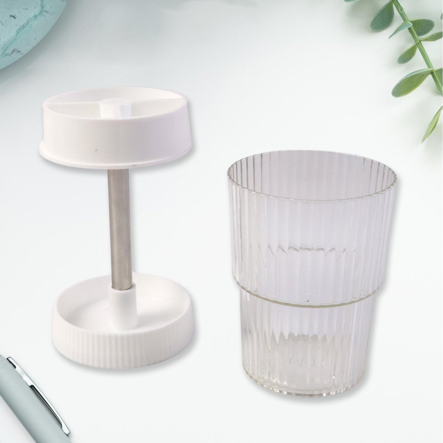 Ribbed tumbler included with rotating toothbrush holder stand for rinsing or storage