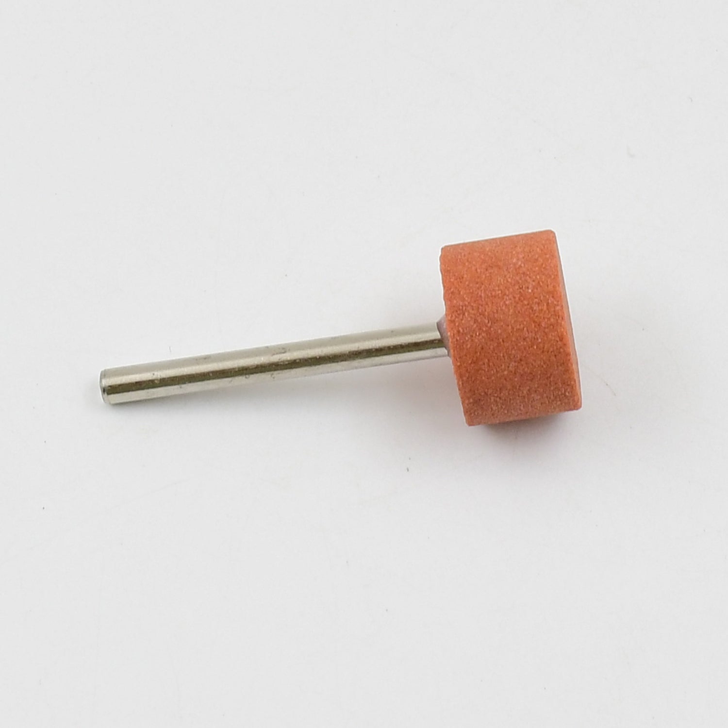 A single cylindrical abrasive grinding wheel with a metal shank on a plain white background.