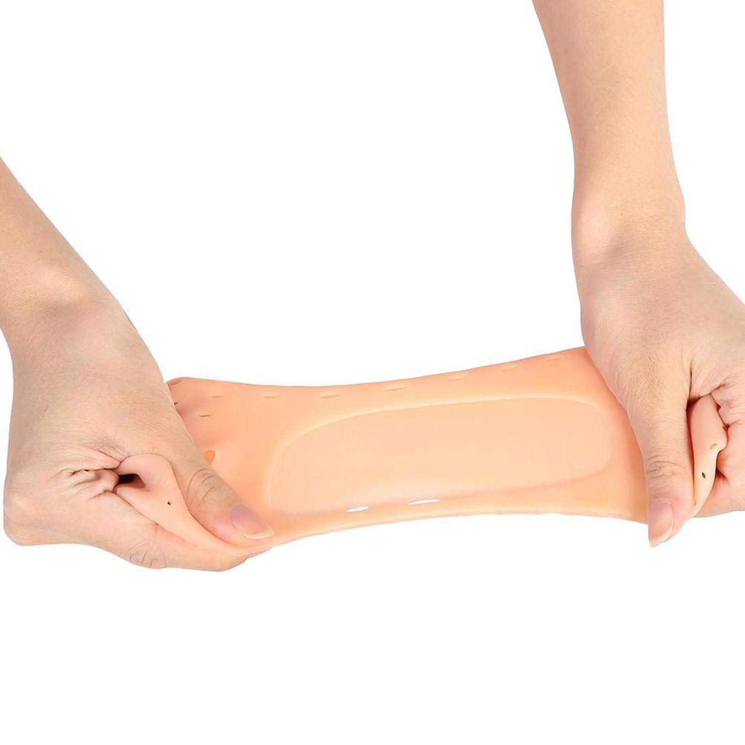 Two hands stretching a single peach silicone heel sock, demonstrating its elasticity.