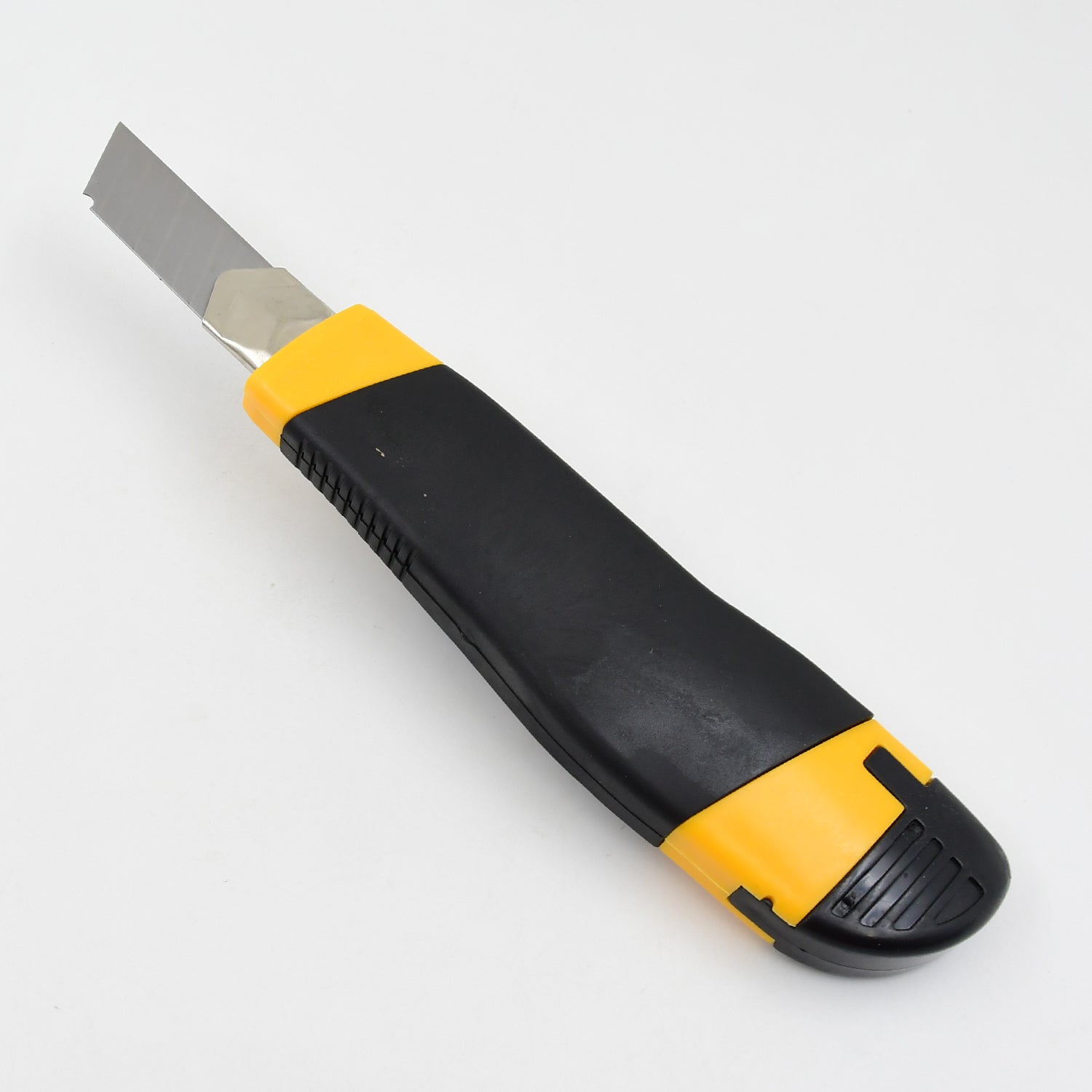 A black and yellow utility knife with a silver blade extended is shown on a plain white background.