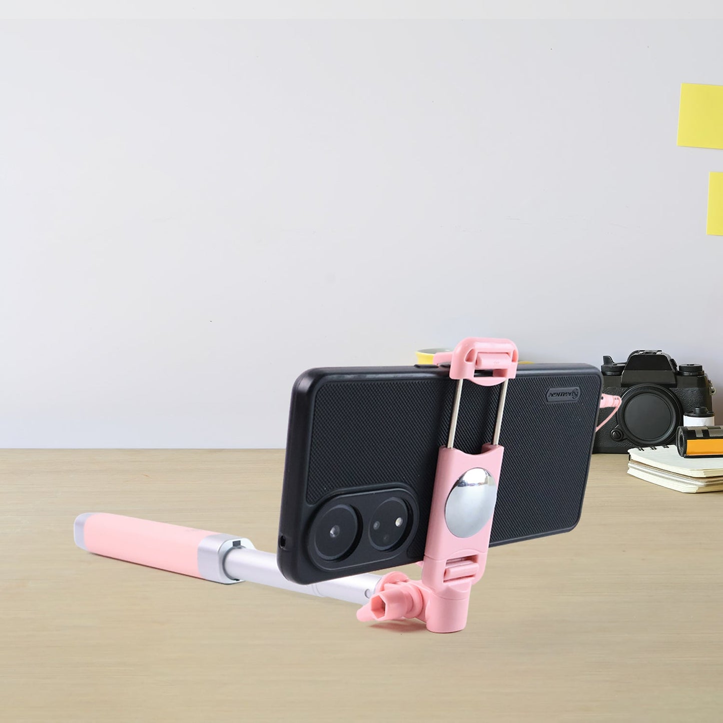 Selfie stick adjustable clamp holding a smartphone securely