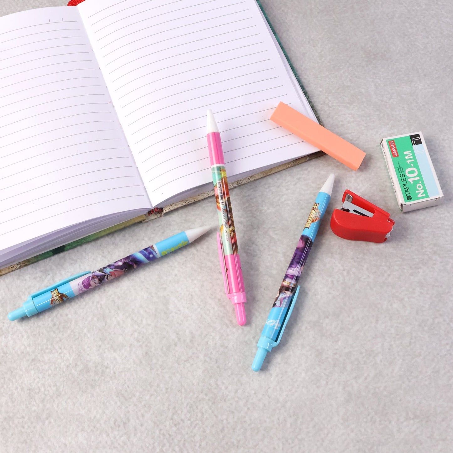 Stationery combo pack featuring colorful pens and compact stapler