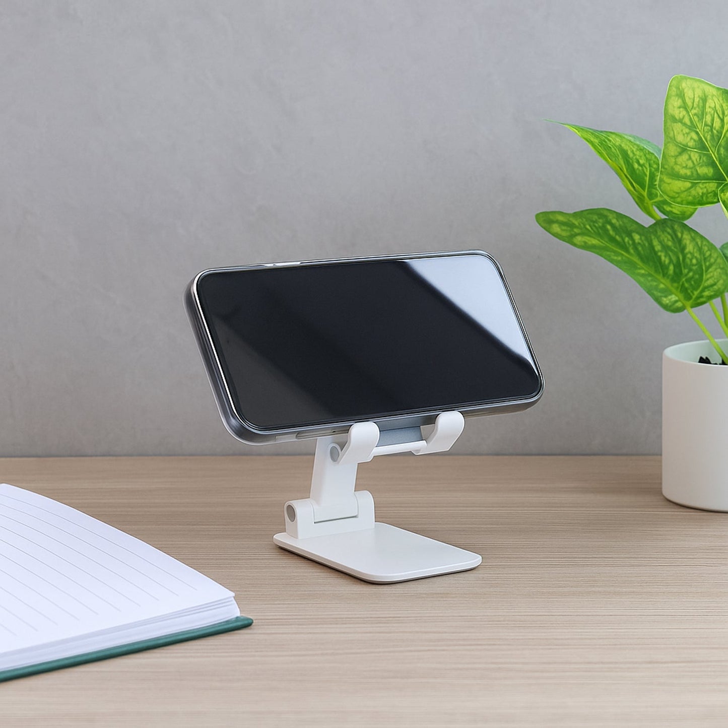 Telescopic adjustable phone holder for desktop use in portrait mode