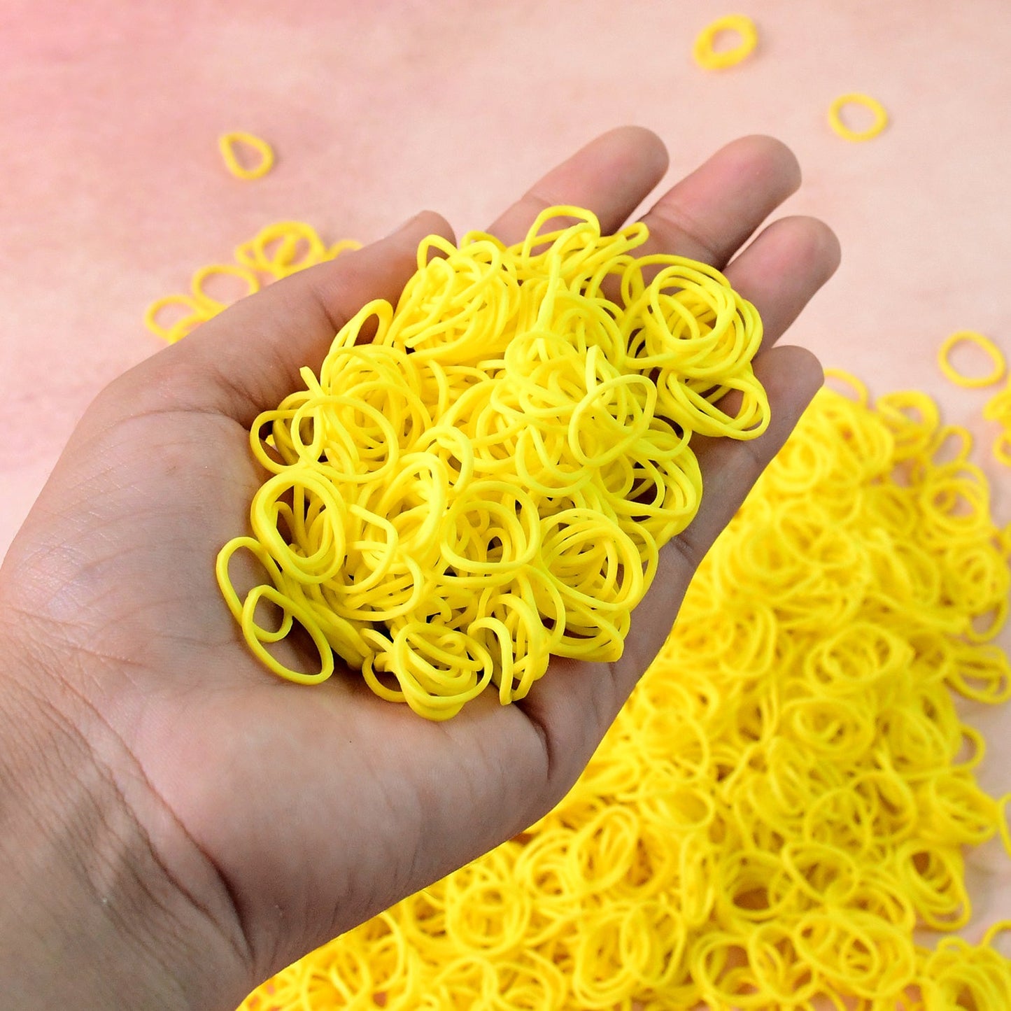 Bright orange elastic rubber bands bundled together