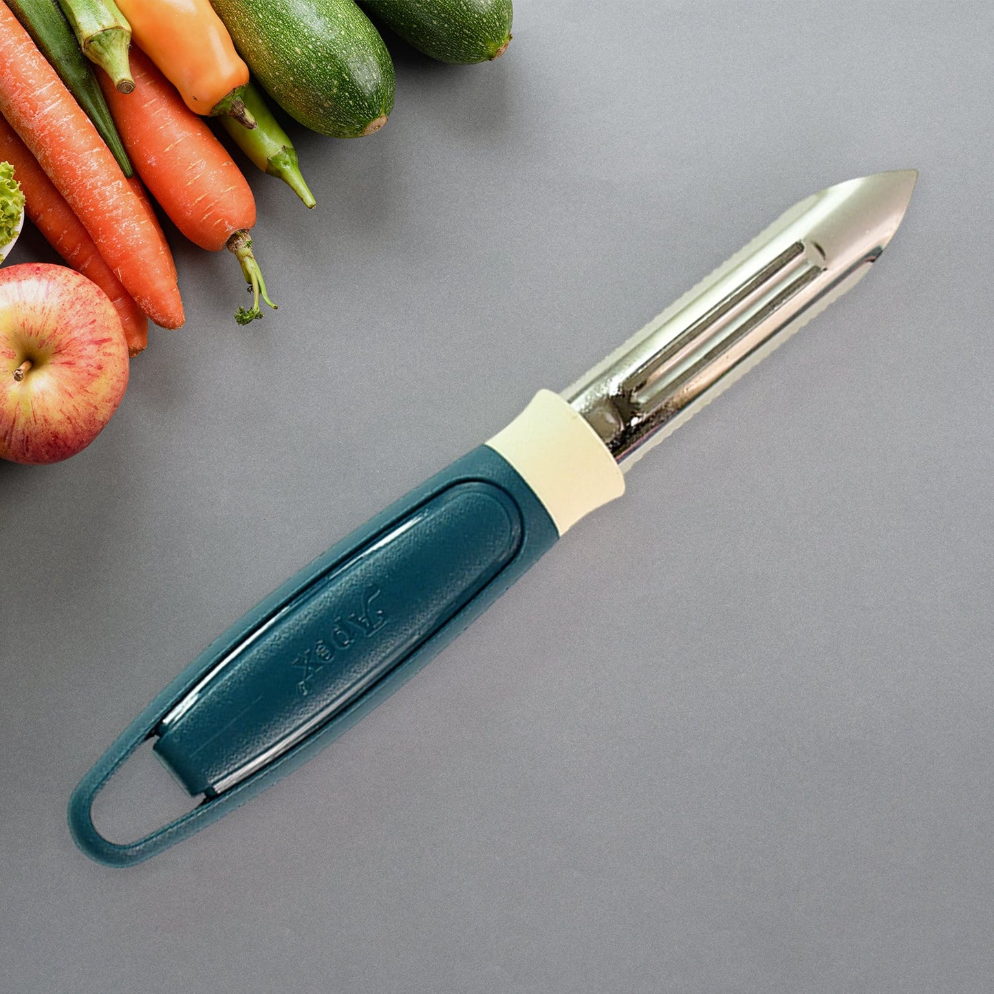 Side angle view of Apex stainless steel blade potato peeler with ergonomic handle