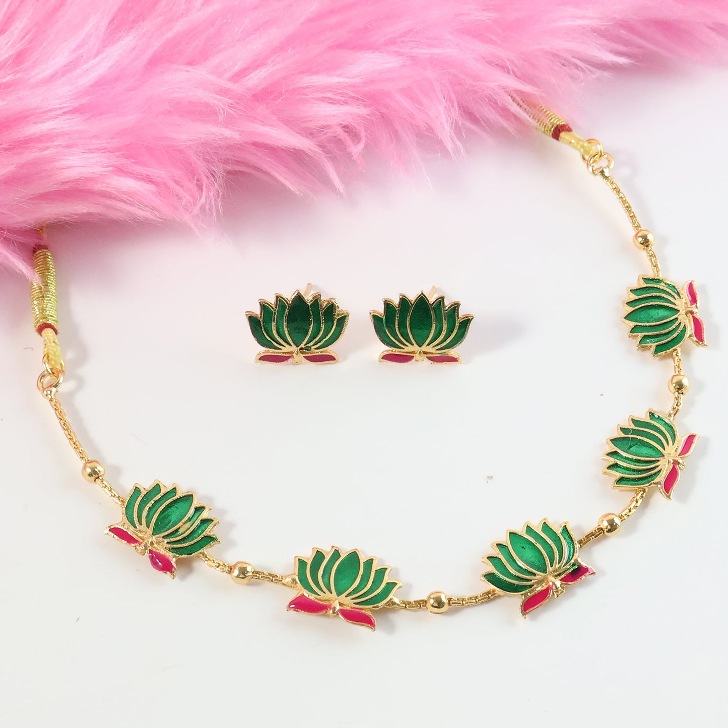 Ethnic jewellery set featuring green lotus motifs necklace and stud earrings