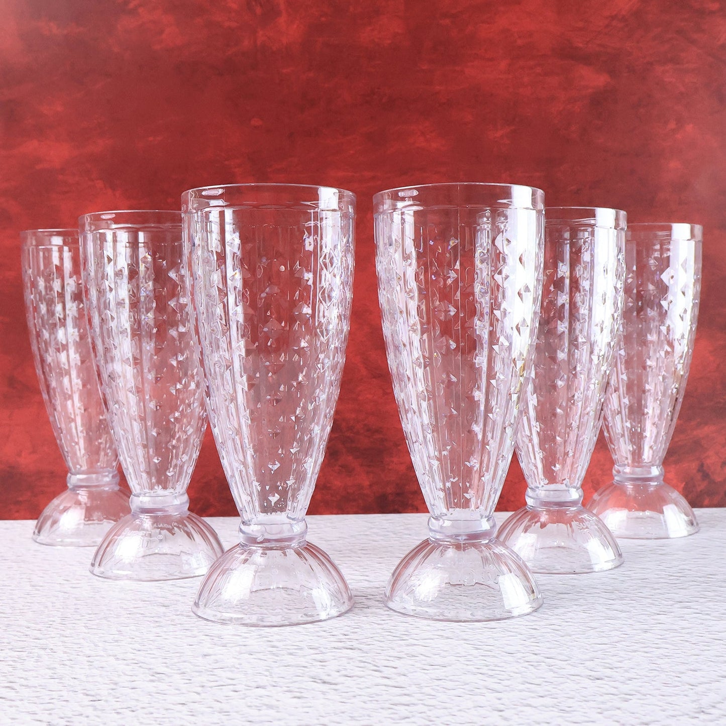 Milkshake glass highlighting footed base and diamond-cut crystal texture