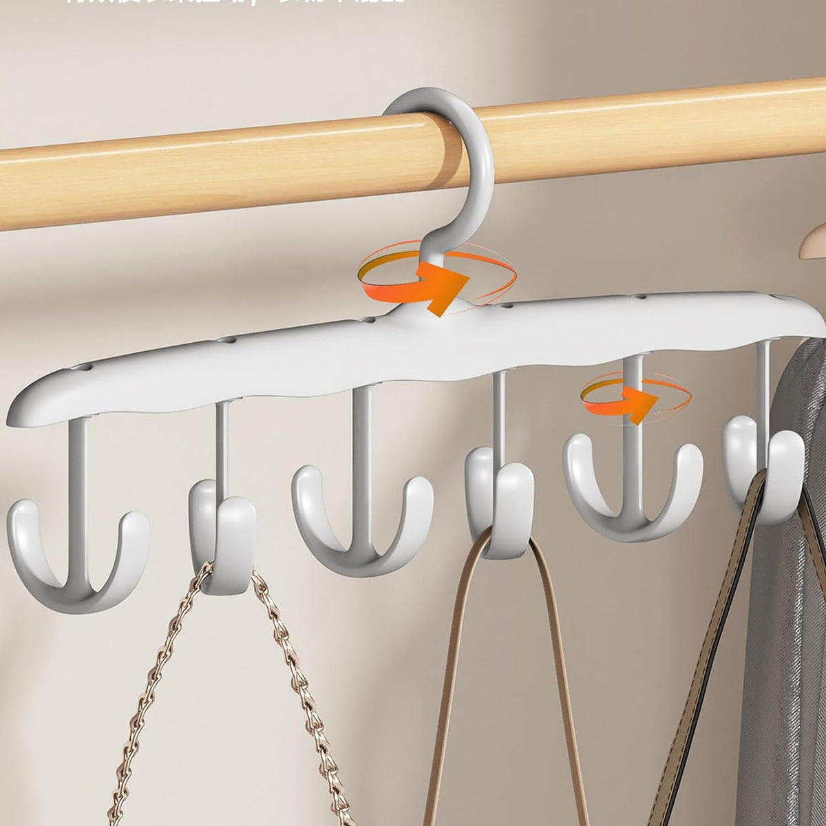 White plastic hanger with six rotating hooks, holding two bags on a wooden closet rod, with Chinese text overlay.