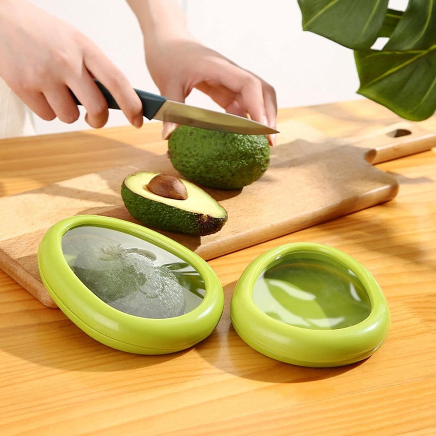 A single green avocado-shaped container with a clear lid is shown on a white background.