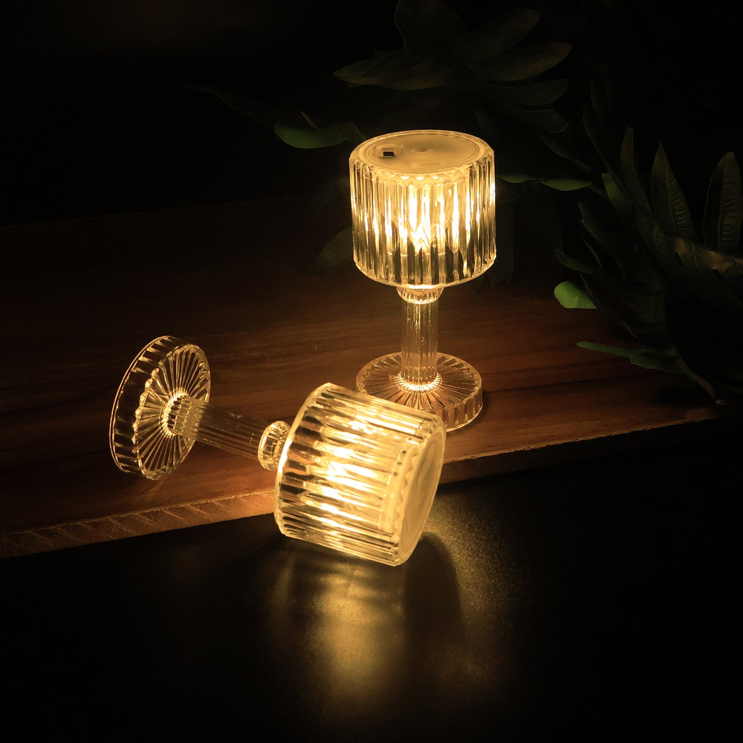 Warm glowing LED crystal-effect table lamps used for festive and event décor
