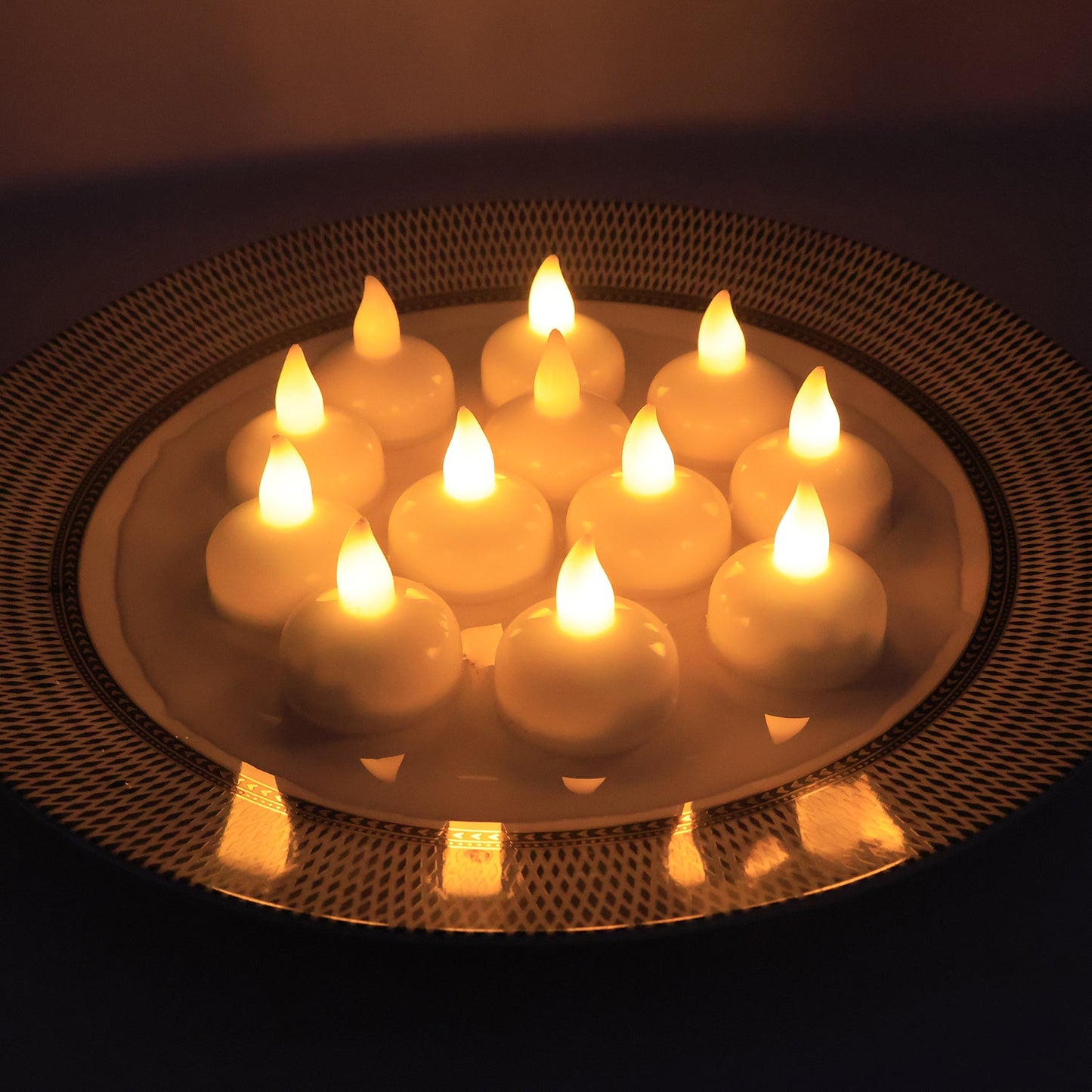 LED floating candles arranged on water surface enhancing home décor ambiance