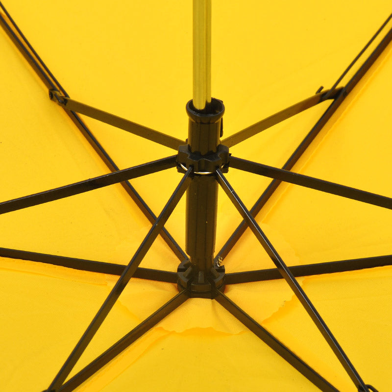 The internal black metal frame and yellow fabric of an open umbrella are visible from underneath.