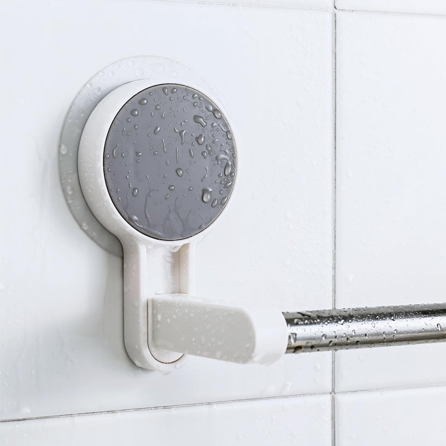 Removable and reusable self-adhesive towel rod mounted on tile wall