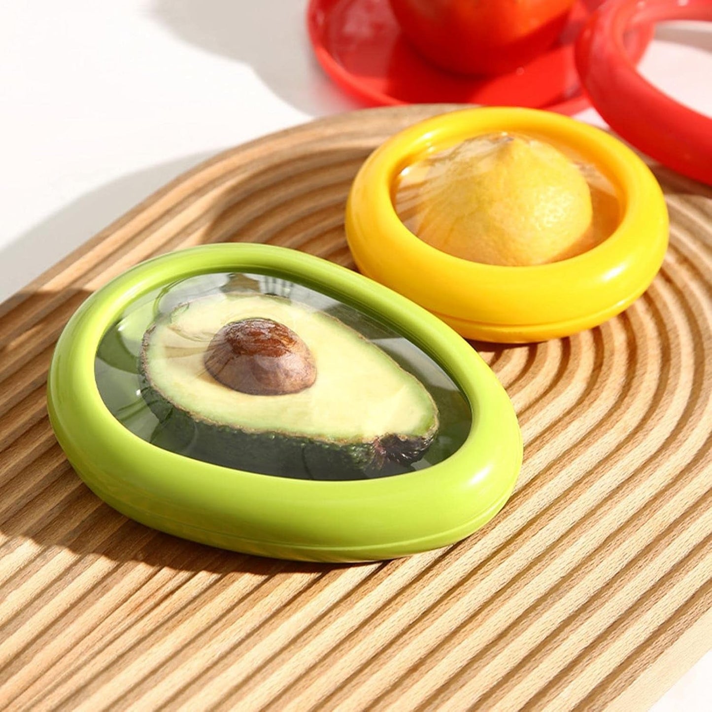 A single green avocado-shaped container is sealed in clear plastic packaging.