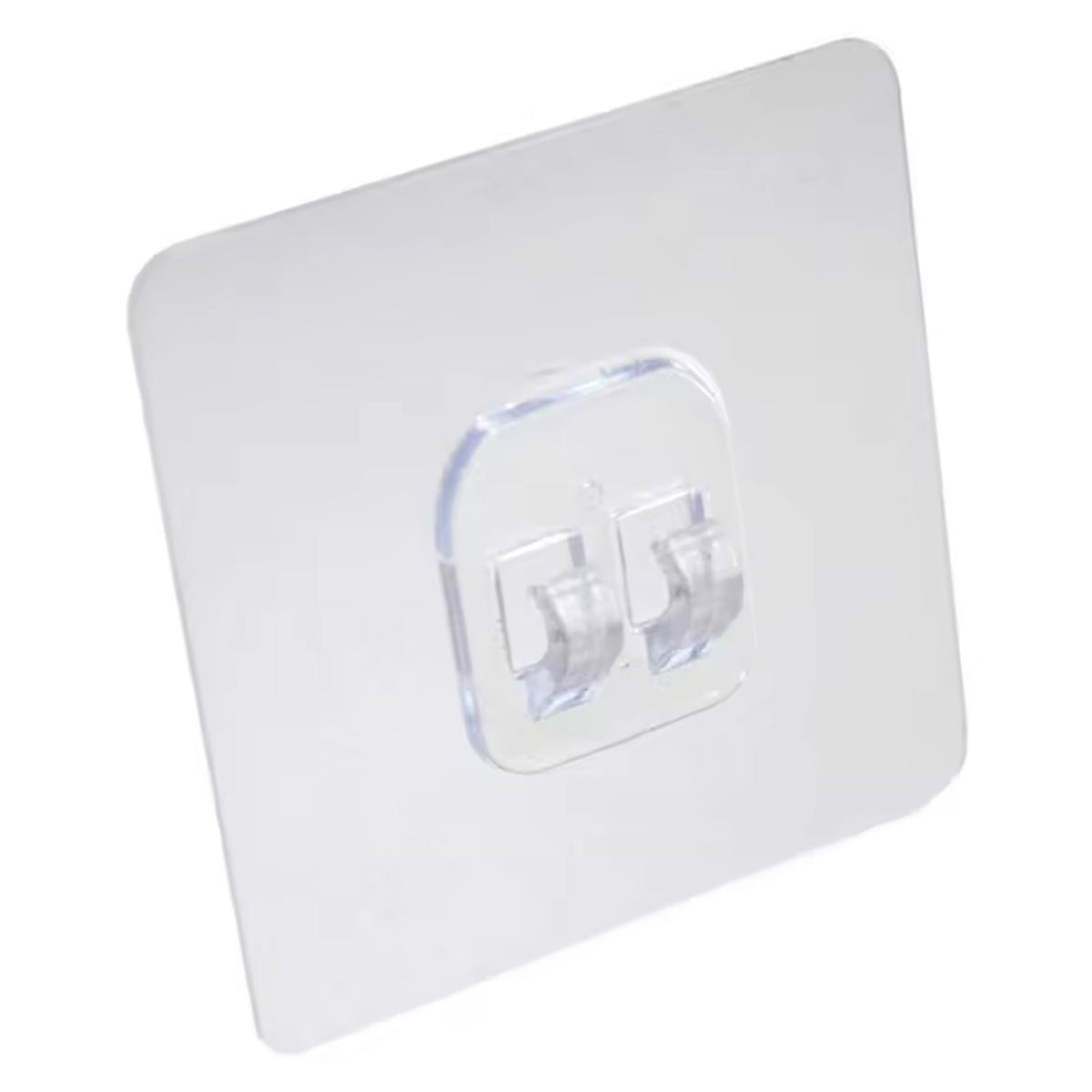 A clear square self-adhesive wall hook with two transparent prongs is shown against a plain white background.